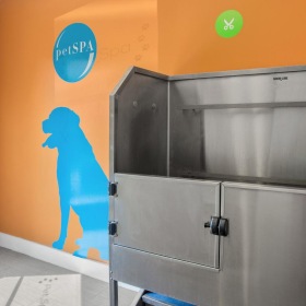 We're a pet-friendly community pet grooming area with steel washing bin and hose