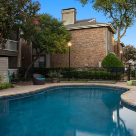 Sparkling swimming pool large community swimming pool at dusk