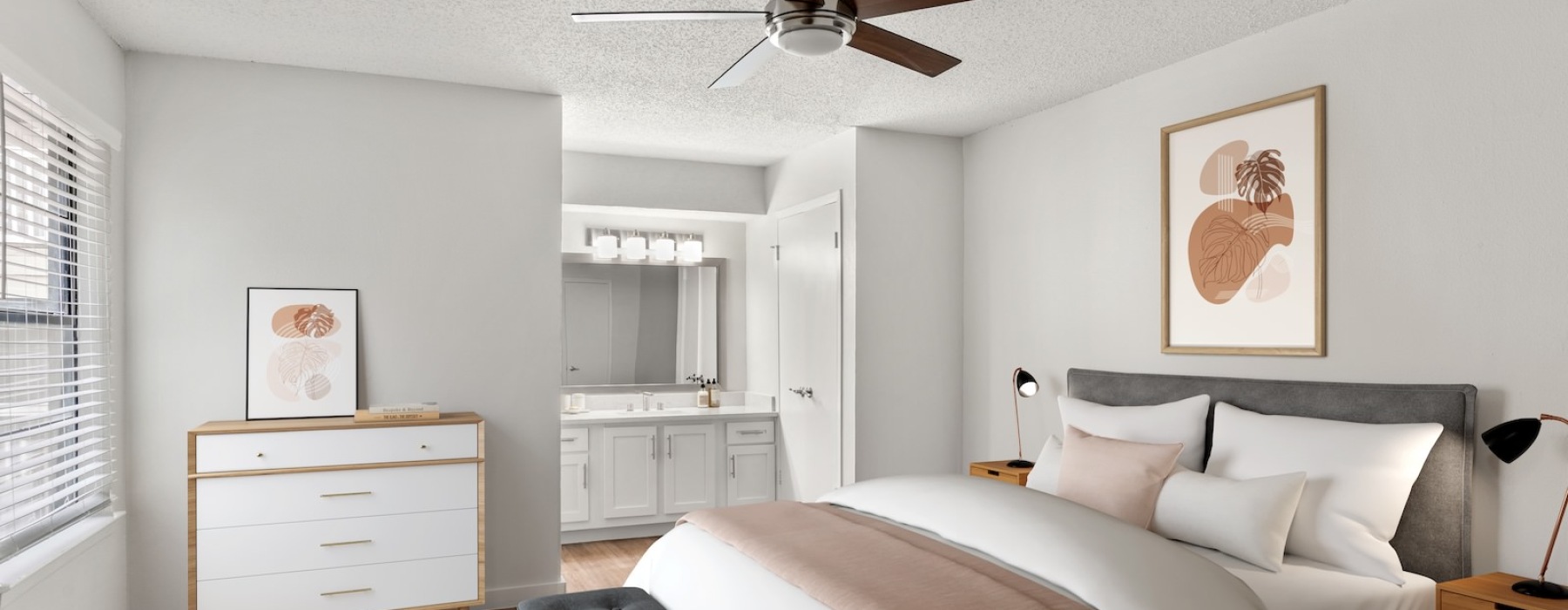 a  furnished bedroom  with painting on the wall and connected vanity area